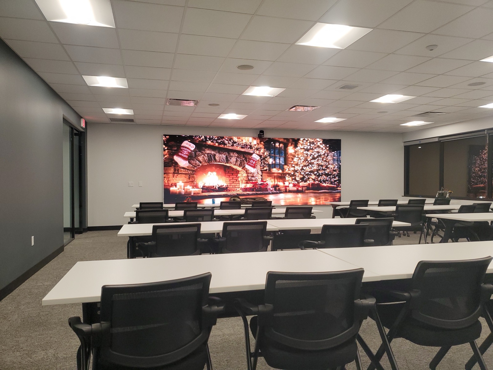 A bright LED wall makes the room feel like an event before the first slide starts.